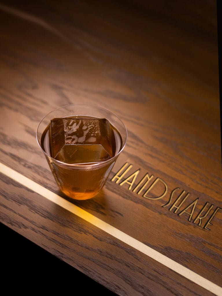 Handshake Speakeasy Cariño